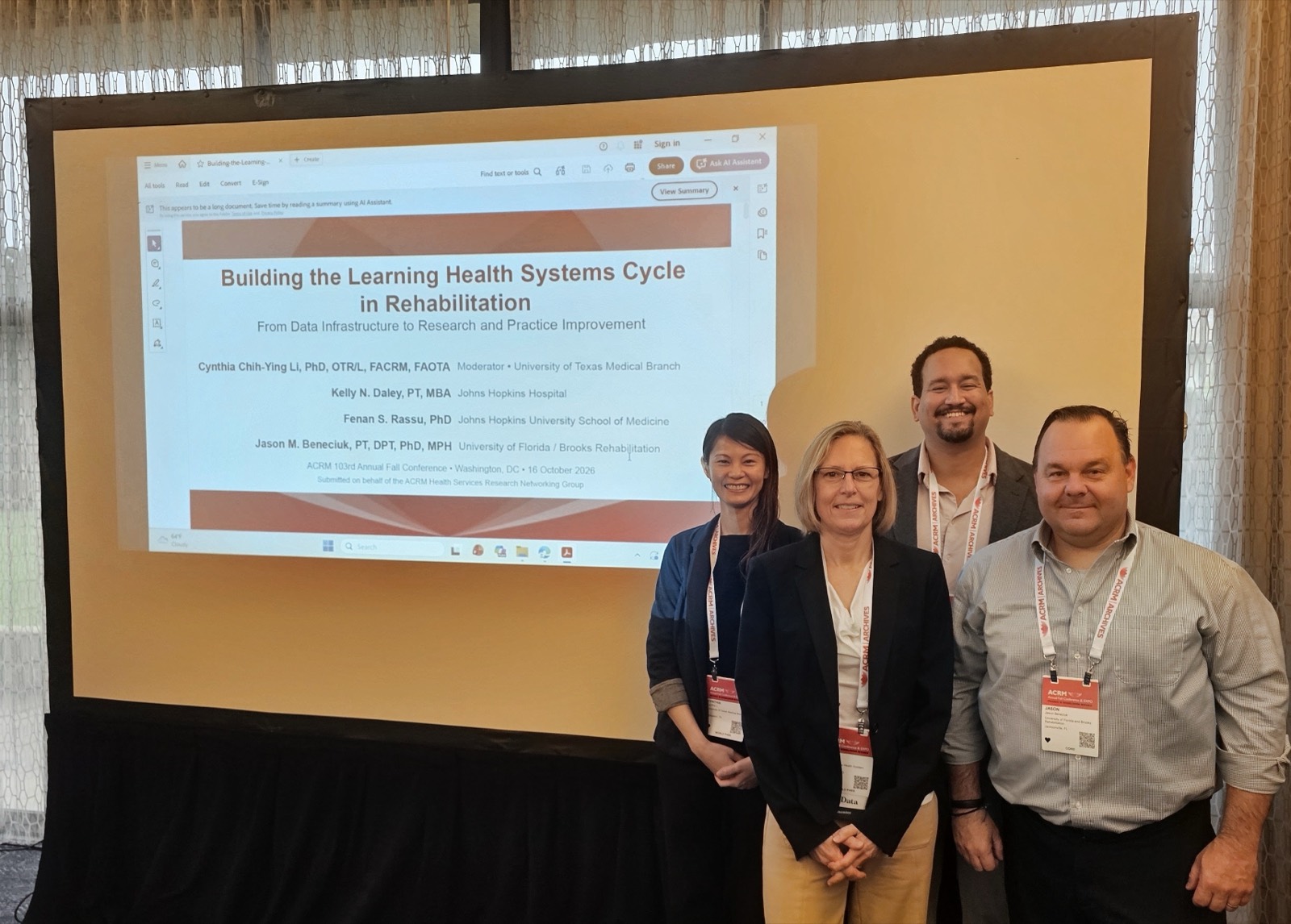 Dr. Cynthia Li, Kelly Daley, Dr. Fenan Rassu, and Dr. Jason Beneciuk in front of their symposium title slide at the ACRM 2026 Annual Fall Conference