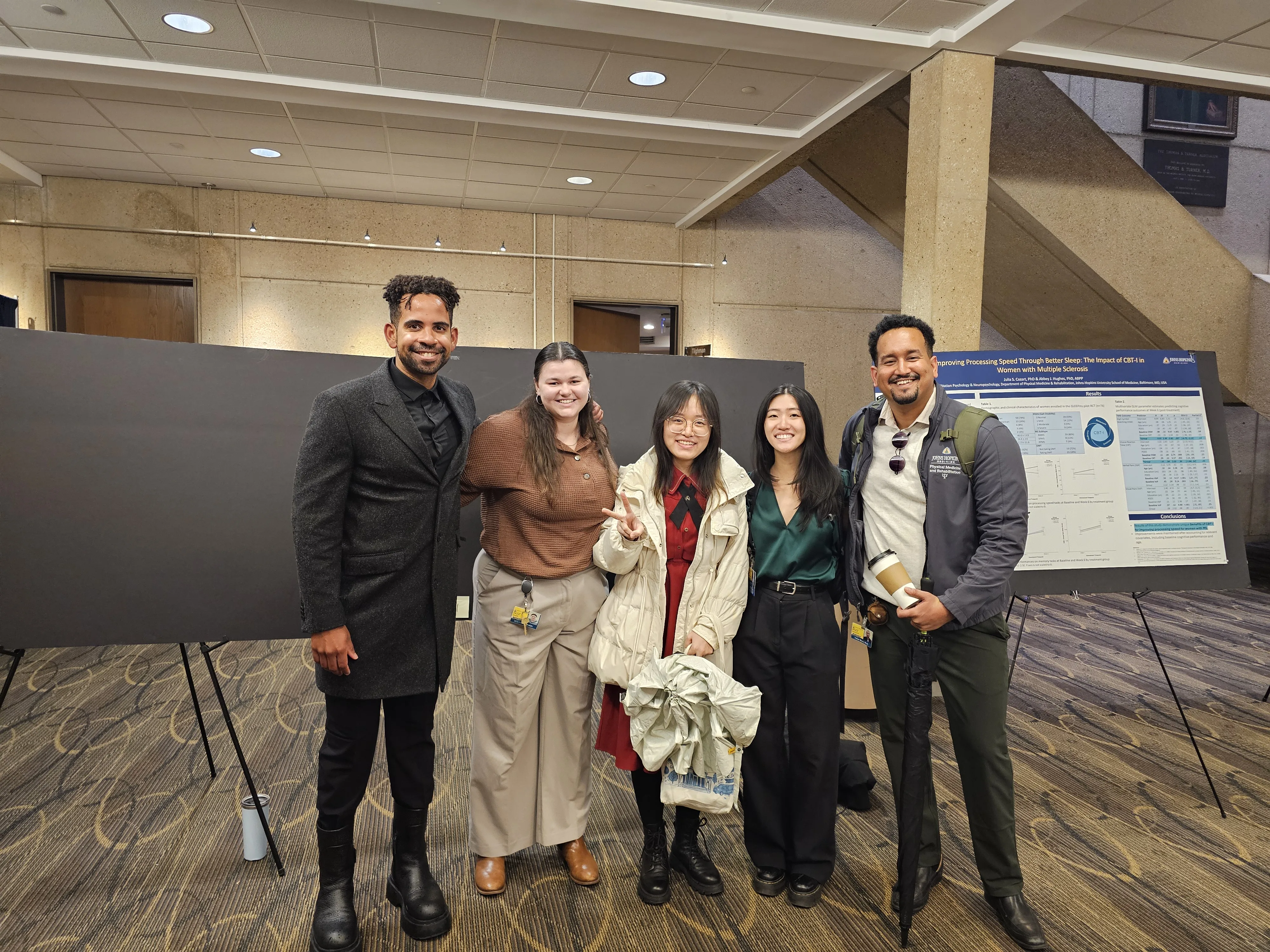 Lab trainees presenting research posters at the 15th PM&R Research and Clinical Expo