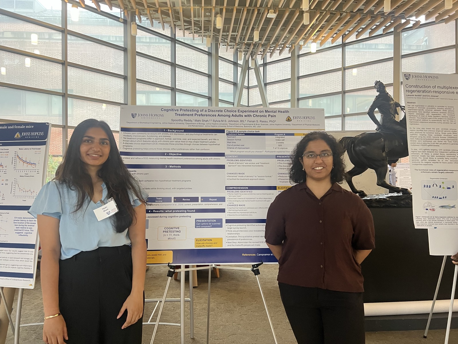Undergraduate research assistants Mahi Shah and Spoorthy Reddy presenting their poster at the Johns Hopkins Summer Research Symposium